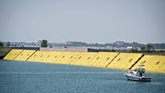 Moveable flood gates rise from the sea in the Venice lagoon, Italy, Friday, July 10, 2020. 