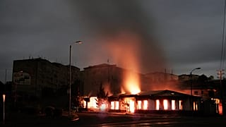 A building of a residential area burns after night shelling by Azerbaijan's artillery during a military conflict in self-proclaimed Republic of Nagorno-Karabakh, Stepanakert.