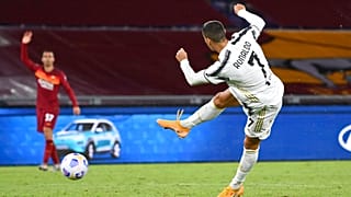 Juventus' Cristiano Ronaldo, right, takes a shot during the Italian Serie A match between Roma and Juventus at Rome's Olympic stadium, Sunday, Sept. 27, 2020.