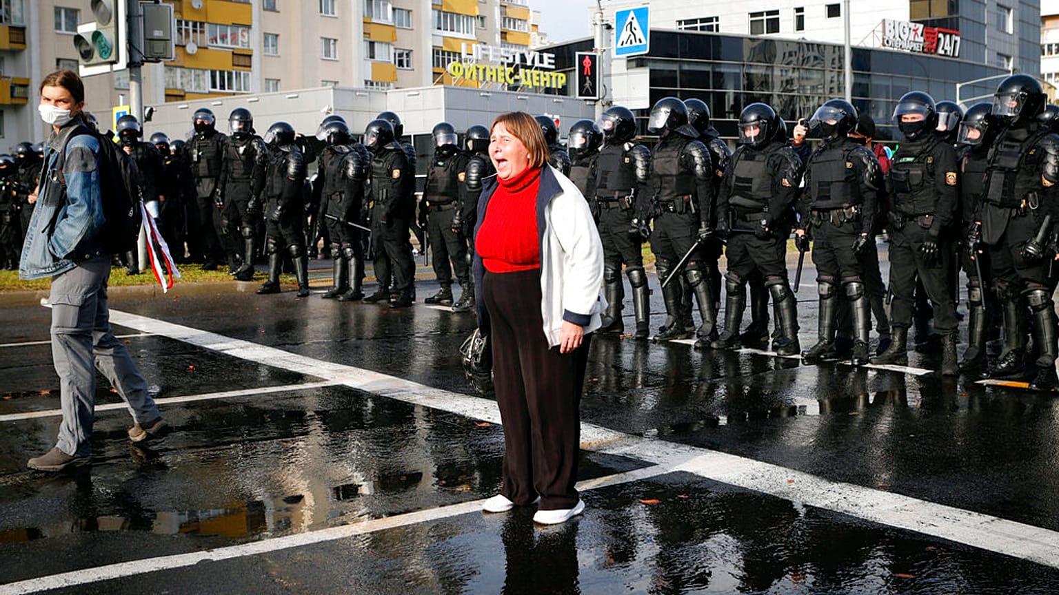 A protester shouts in front of a riot police line during a rally in Minsk, Belarus, Sunday, Oct. 4, 2020. 