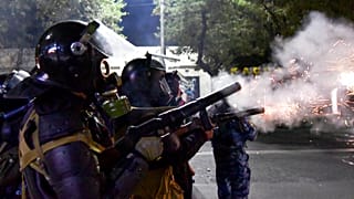 Riot police disperse protesters during a rally against the results of a parliamentary vote in Bishkek, Kyrgyzstan, Monday, Oct. 5, 2020.