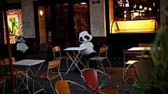 Panda bear cuddly toys rest in an empty terrace of a restaurant in downtown Brussels, Saturday, Oct. 3, 2020. 
