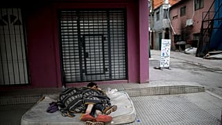 Homeless women sleep outside during a government-ordered lockdown to curb the spread of COVID-19 in Buenos Aires, Argentina on May 6, 2020