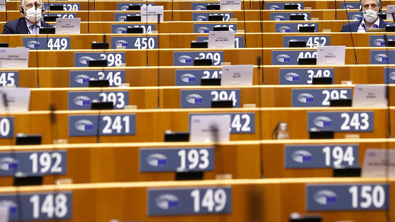 MEPs, wearing face masks to fight against the spread of the coronavirus, attend a plenary session at the European Parliament in Brussels