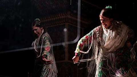 Flamenco dancer Marina Perez performs behind screens during a flamenco show at the Torres Bermejas, live flamenco venue, in Madrid, Spain