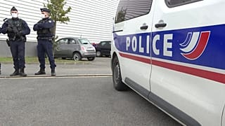 Police officers at the scene of a shooting which left two police officers in serious condition in hospital