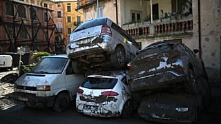 Cars stacked on top of each other by clean up crews are pictured in Breil-sur-Roya, near the border with Italy. October 5, 2020