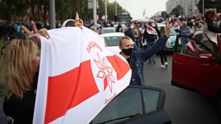 People march during an opposition rally to protest the official presidential election results in Minsk, Belarus, Oct. 4, 2020.