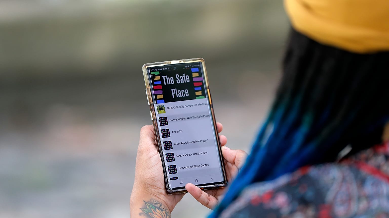 Jasmin Pierre with her smartphone app, a free Black-oriented mental health app that's seen more signups during the pandemic, New Orleans, July 2, 2020.