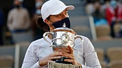 Poland's Iga Swiatek holds the trophy after winning the French Open, beating Sofia Kenin of the US 6-4, 6-1 in the final at Roland Garros, Paris, October 10, 2020.