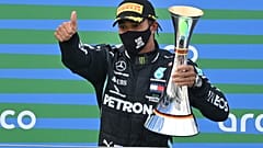 Mercedes driver Lewis Hamilton of Britain holds the trophy after winning the Eifel Formula One Grand Prix in Nuerburg, Germany, Sunday, Oct. 11, 2020. 