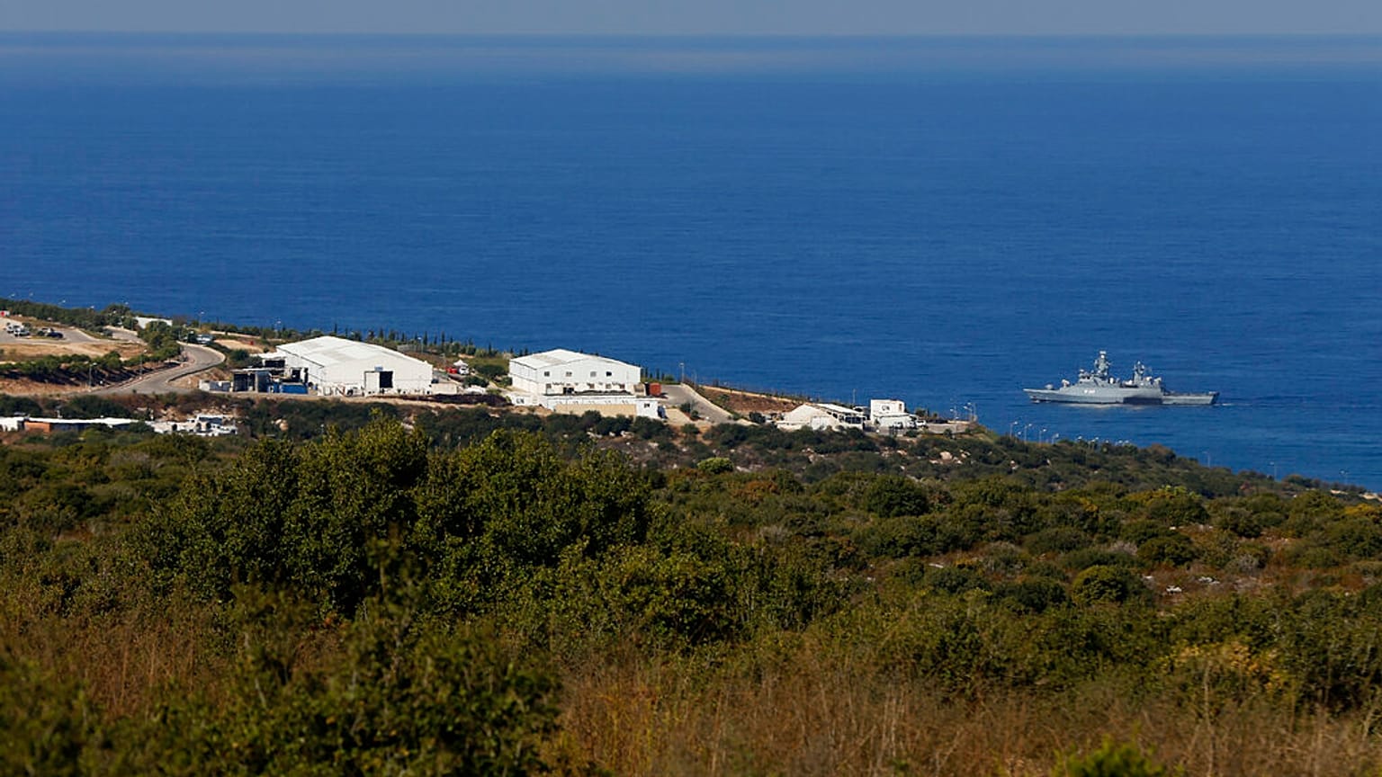 A UNIFIL Navy ship patrols in the Mediterranean Sea next to a base of the U.N. peacekeeping force, off the southern town of Naqoura, Lebanon, Wednesday, Oct. 14, 2020. 