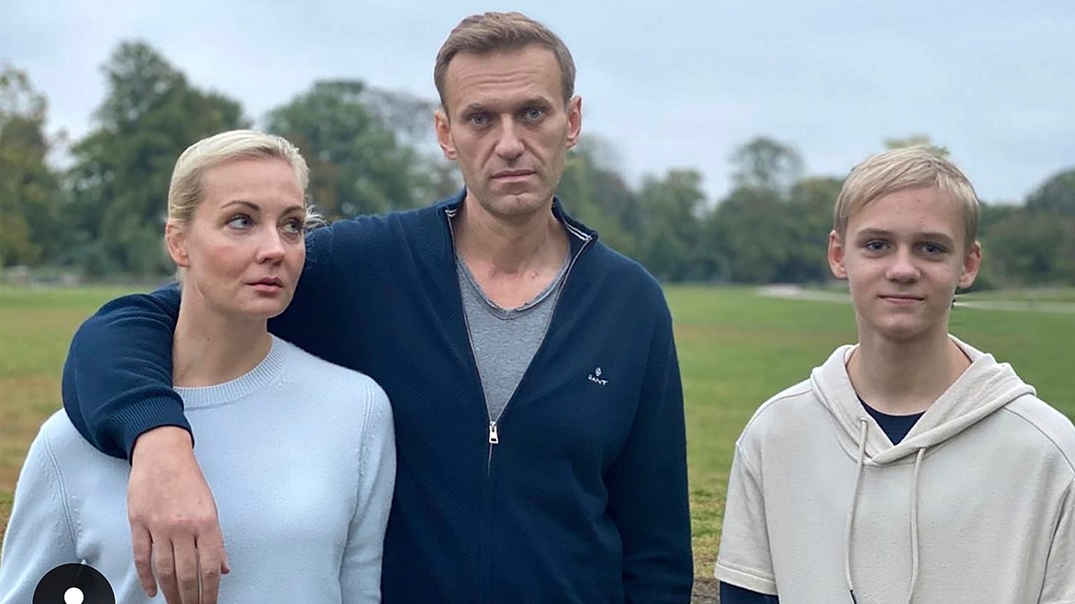 Navalny, centre, poses for a photo with his wife Yulia and their son Zahar in an unknown location in Germany.