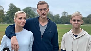Navalny, centre, poses for a photo with his wife Yulia and their son Zahar in an unknown location in Germany.