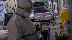 A medical monitor displays the vital life signs of a patient infected with COVID-19 at an ICU on the outskirts of Madrid, October 2020