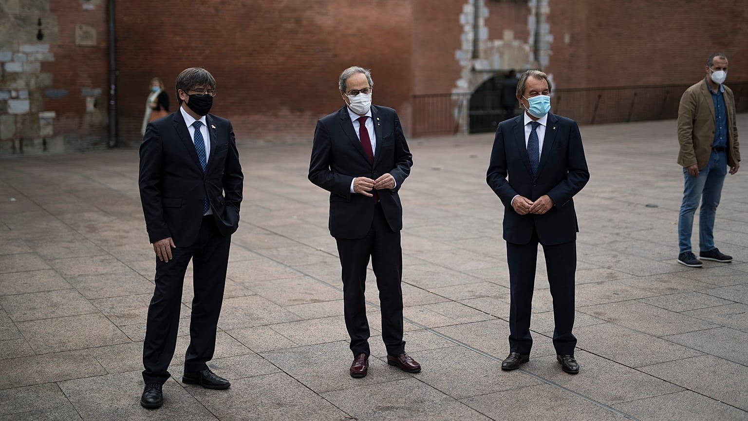 Carles Puigdemont, left, Quim Torra, centre, and Artur Mas, right, pose for a picture in Perpignan.