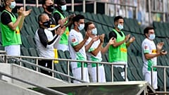 FILE-In this May 31, 2020 file photo Moenchengladbach alternate players wearing face masks applaud during the German Bundesliga match against Union Berlin.