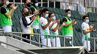 FILE-In this May 31, 2020 file photo Moenchengladbach alternate players wearing face masks applaud during the German Bundesliga match against Union Berlin.