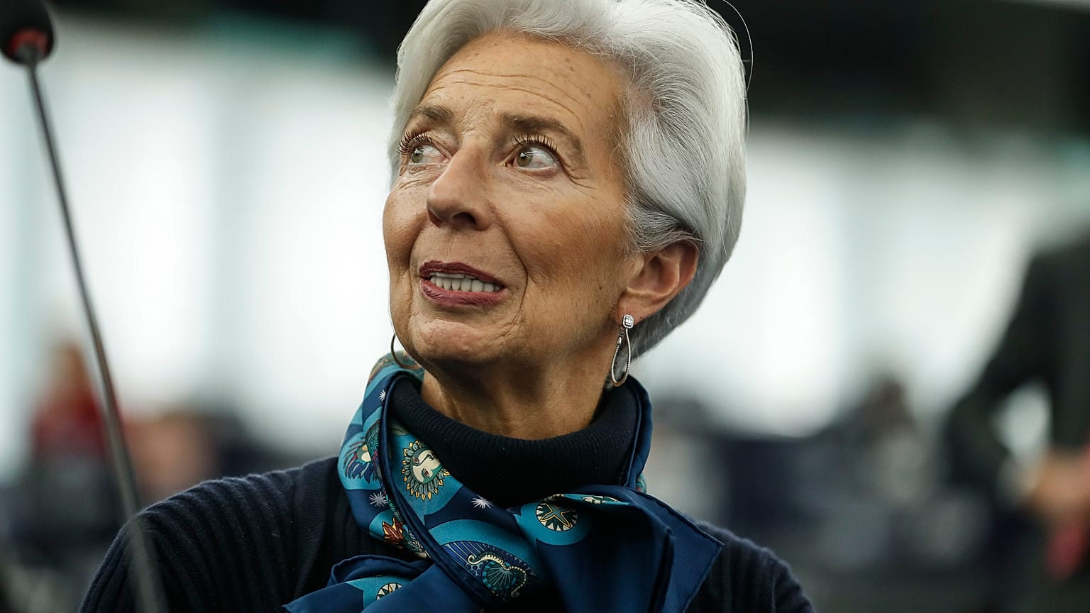 In this Tuesday Feb. 11, 2020 file photo, Christine Lagarde president of the ECB looks up prior to deliver her speech before the European Parliament's economic and monetary af