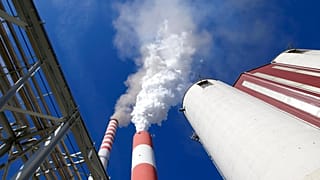 In this photo taken Wednesday, Oct. 3, 2018, smoke rises from the chimneys of Serbia's main coal-fired power station near Kostolac, Serbia.
