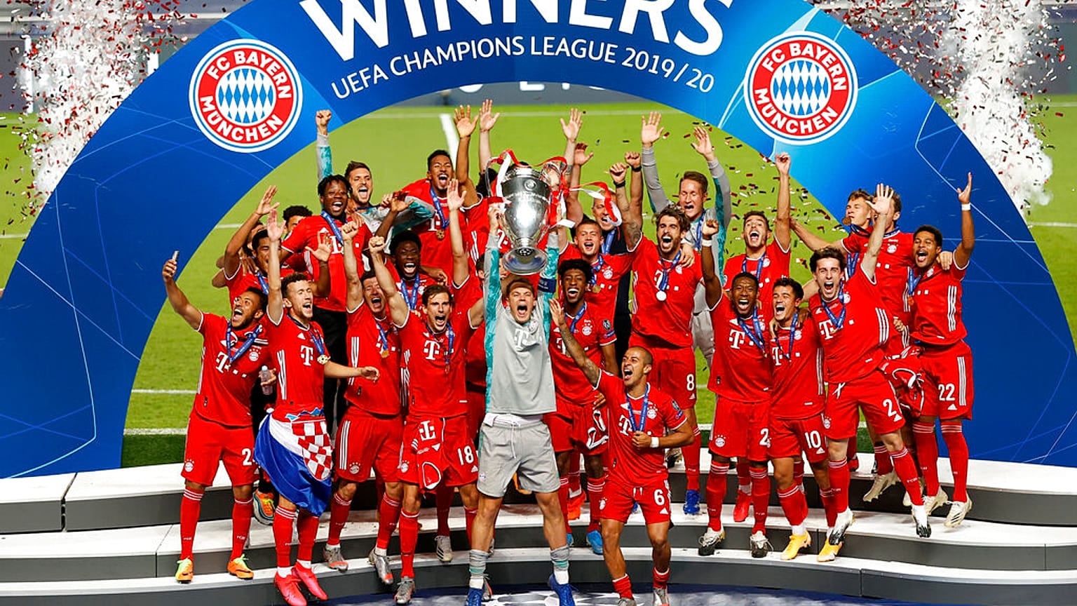 Bayern's goalkeeper Manuel Neuer lifts the trophy after Munich won the Champions League final soccer match.
