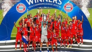 Bayern's goalkeeper Manuel Neuer lifts the trophy after Munich won the Champions League final soccer match.