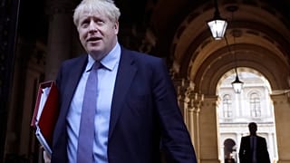 Britain's Prime Minister Boris Johnson returns to Downing Street after attending a Cabinet meeting in London, Tuesday, Oct. 20, 2020. 