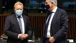 European Union Commissioner for Agriculture Janusz Wojciechowski, left, speaks with Cyprus' Agriculture Minister Costas Kadis at a meeting of agriculture ministers on Oct. 19.