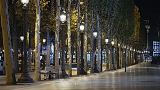 Champs-Elysees avenue is empty during curfew in Paris, Saturday, Oct. 17, 2020.