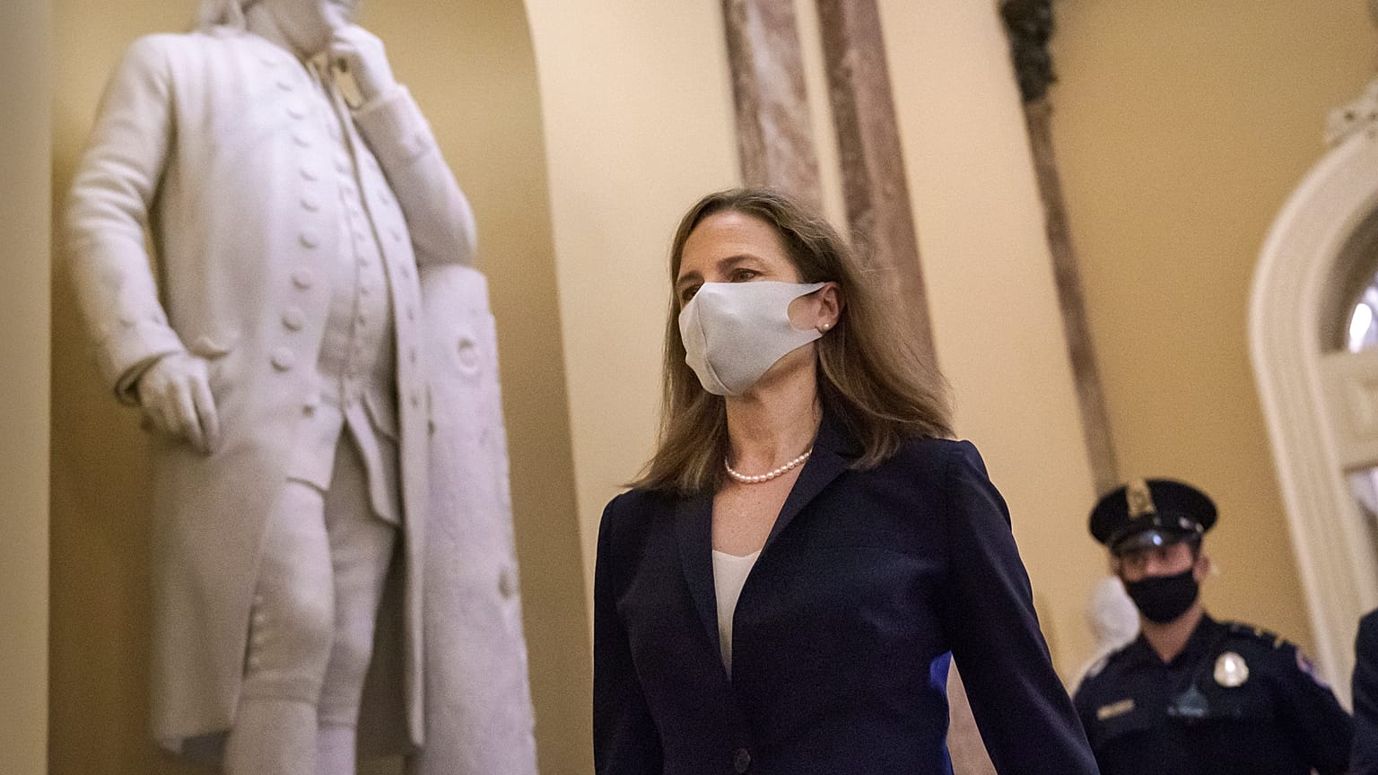 Judge Amy Coney Barrett, President Donald Trump's nominee for the Supreme Court, arrives for closed meetings with senators, at the Capitol in Washington, Wednesday, Oct. 21.