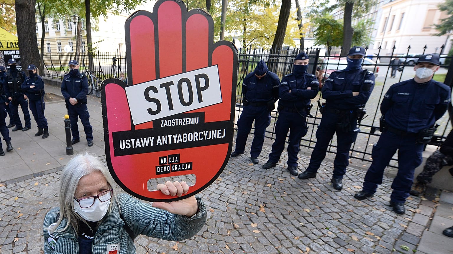 A protester holds a sign reading "stop tightening the law" at a pro-choice protest in front of Poland's constitutional court. Warsaw, Poland. Oct. 22, 2020.