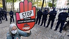 A protester holds a sign reading "stop tightening the law" at a pro-choice protest in front of Poland's constitutional court. Warsaw, Poland. Oct. 22, 2020.