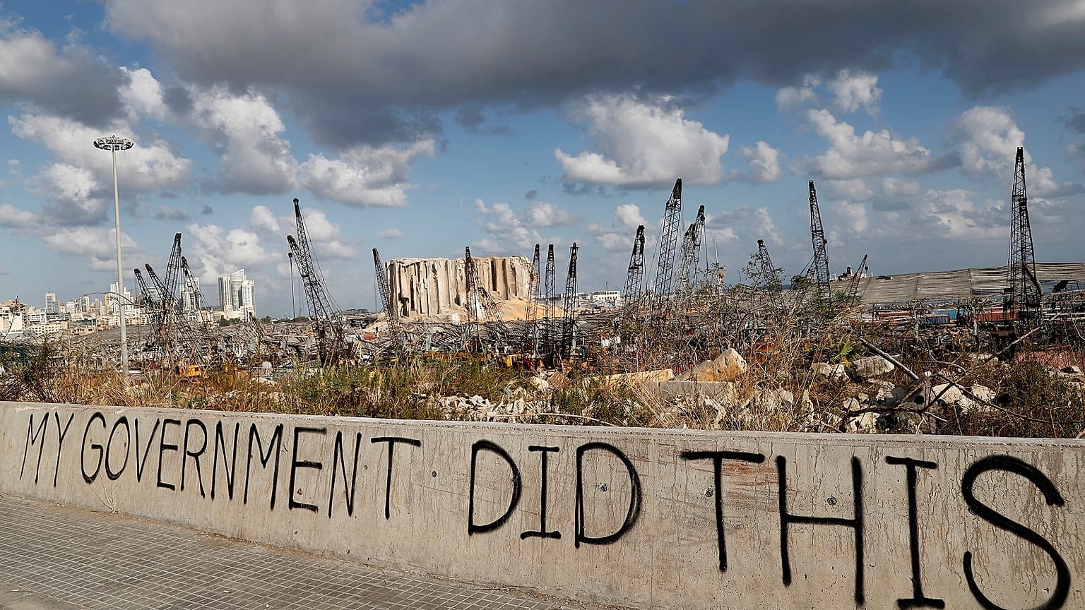 Political graffiti is visible in front of the scene of the August 4 explosion that hit the seaport of Beirut, Lebanon.