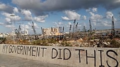 Political graffiti is visible in front of the scene of the August 4 explosion that hit the seaport of Beirut, Lebanon.