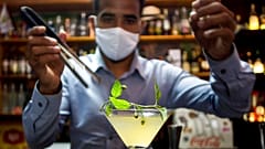 bartender Dagoberto Jesus Morejon prepares a "Martini de Oro," or Golden Martini, a cocktail using a plant endemic to Cuba called the "Orozus de la Tierra." 