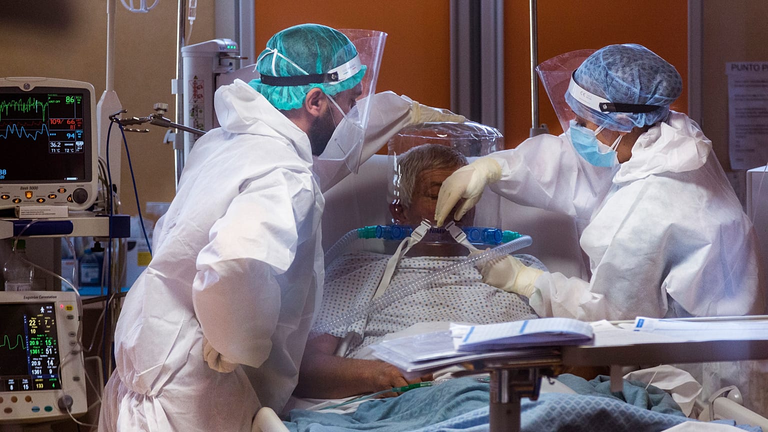 Medical staff of the Intensive Care Unit of the Casalpalocco COVID-19 Clinic in the outskirts of Rome tend to patients, Wednesday, Oct. 21, 2020.