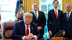 President Donald Trump listens while on a phone call with leaders of Sudan and Israel in the Oval Office of the White House, Friday, Oct. 23, 2020.