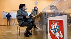 Lithuanians wait for ballots at a polling station during early voting in the second round of elections in Vilnius, Lithuania, on Thursday, October 22, 2020.
