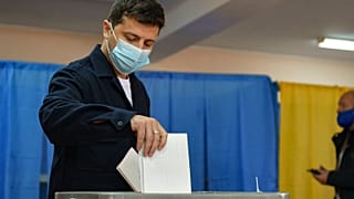 Ukrainian President Volodymyr Zelenskiy casts his ballots at a polling station during a local elections in Kyiv, Ukraine.