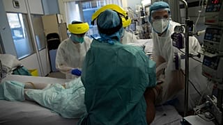 Medical staff work in the intensive care ward for COVID-19 patients at the CHR Citadelle hospital in Liege, Belgium, Wednesday, Oct. 21, 2020.