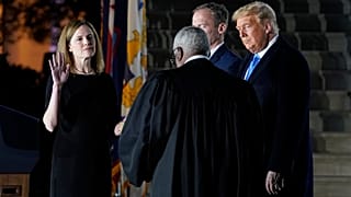 President Donald Trump watches as the Constitutional Oath is administered to Amy Coney Barrett at the White House in Washington, Ocober 26, 2020.