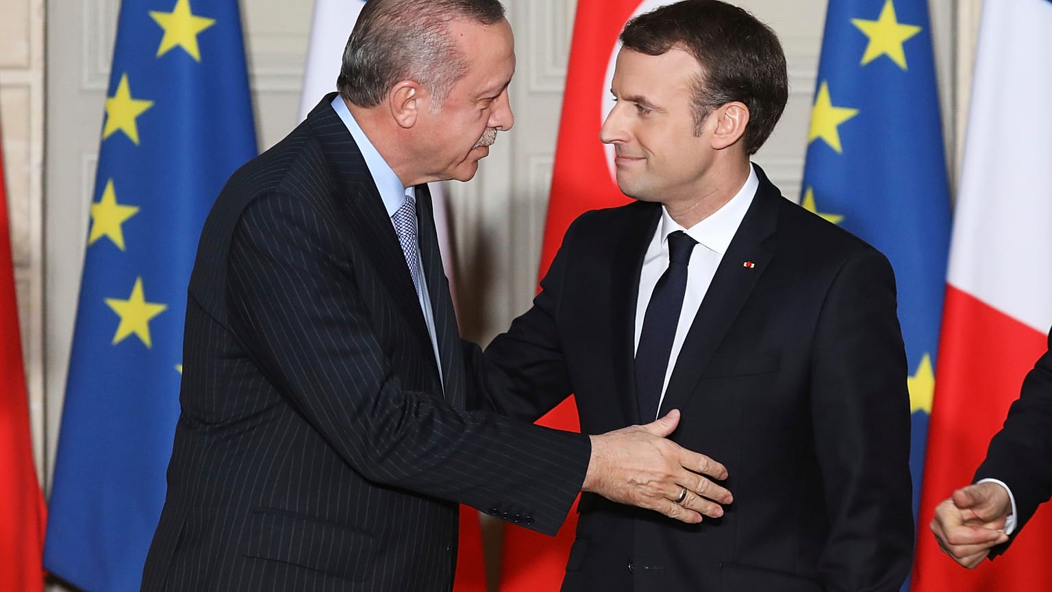 Turkish President Recep Tayyip Erdogan, left, and French President Emmanuel Macron arrives for a press conference at the Elysee Palace in Paris, Friday, Jan.5, 2018
