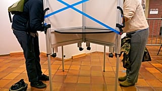 Des électeurs aux urnes à l'hôtel de ville de Boston lors du vote anticipé, le 26 octobre 2020