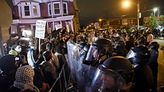 Protesters face off with police during a demonstration Tuesday, Oct. 27, 2020, in Philadelphia. Hundreds marched over the police shooting of Walter Wallace, 27.