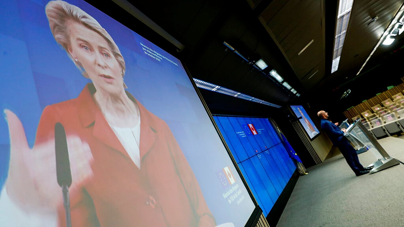 European Council President Charles Michel, right, and European Commission President Ursula von der Leyen, left, via video link
