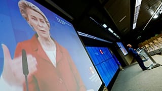 European Council President Charles Michel, right, and European Commission President Ursula von der Leyen, left, via video link