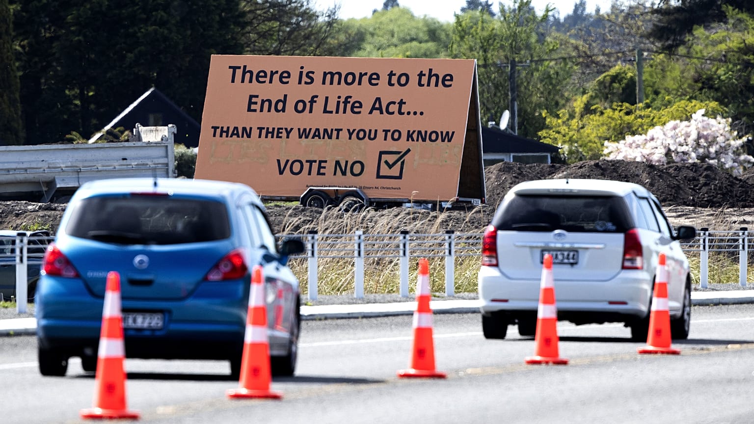In this Oct. 16, 2020, file photo, cars are driven past a billboard urging voters to vote "No" against euthanasia in Christchurch, New Zealand