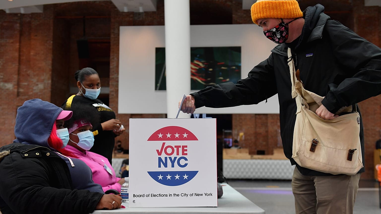 A voter drops off his early voting ballot for the 2020 Presidential election at the Brooklyn Museum in New York City on October 30, 2020. 