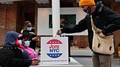 A voter drops off his early voting ballot for the 2020 Presidential election at the Brooklyn Museum in New York City on October 30, 2020. 
