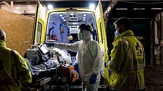 Ambulance crew work as a patient arrives at the CHR CItadelle hospital in Liege, Belgium